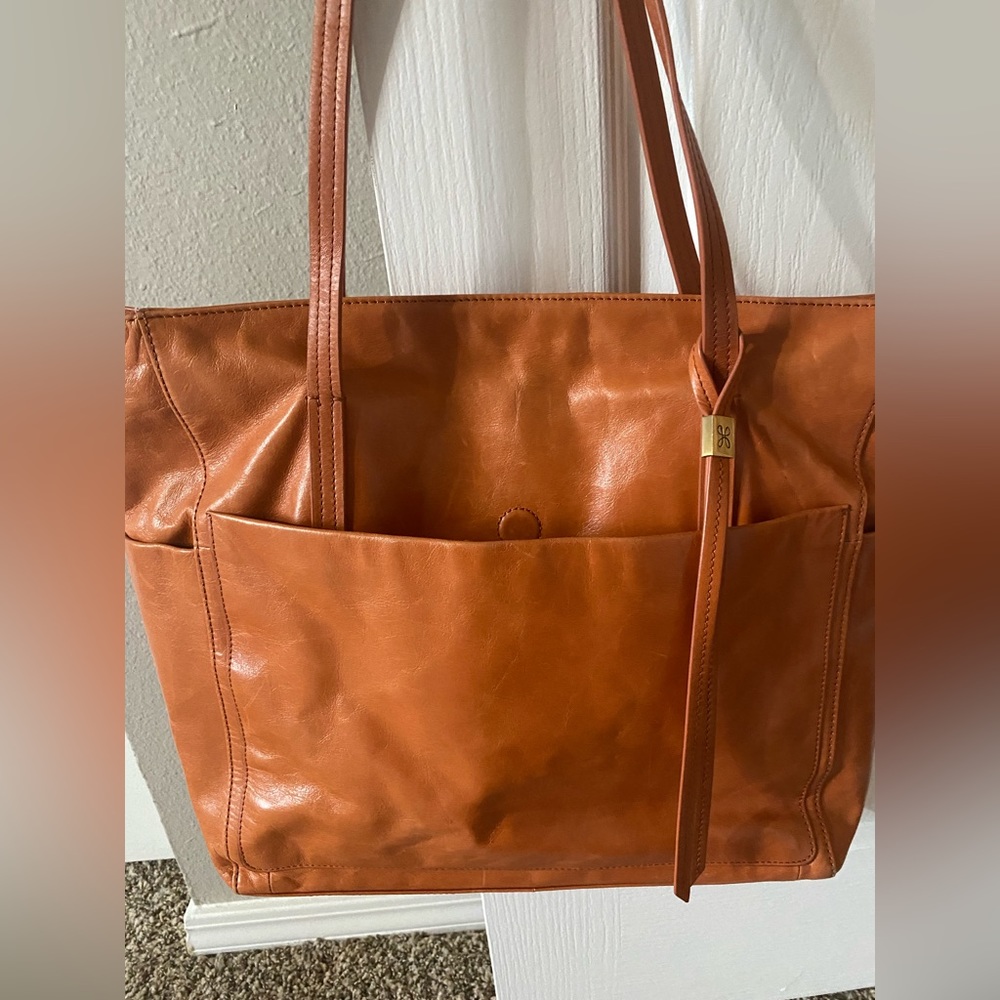 Hobo brand tote bag with beautiful lining and multiple storage pockets
